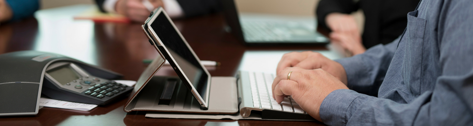 Online Banking - Man typing on iPad keyboard